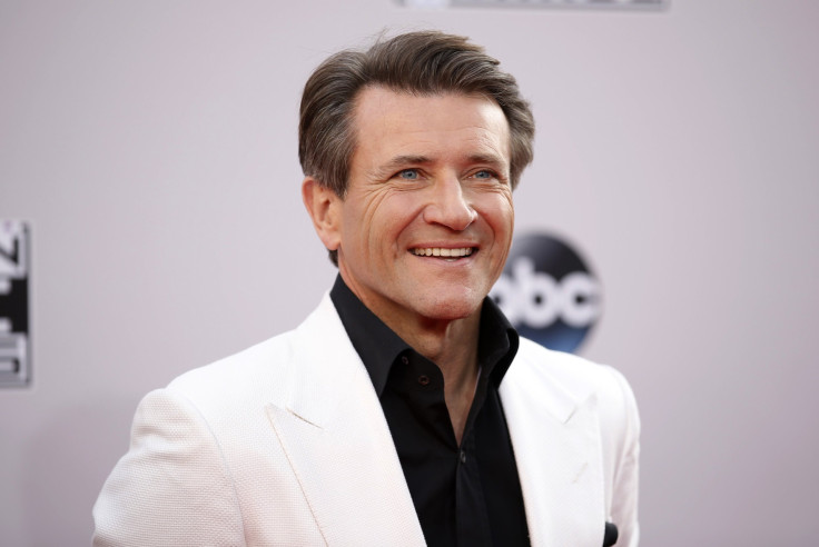 [10:57] Robert Herjavec, from the reality show "Shark Tank," arrives at the 42nd American Music Awards in Los Angeles