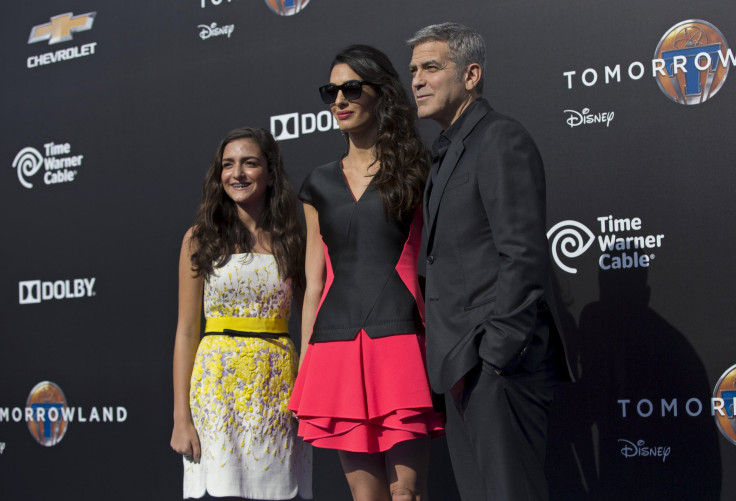[7:21] Cast member George Clooney poses with his wife Amal and her niece Mia Alamuddin (L) at the premiere of "Tomorrowland" 