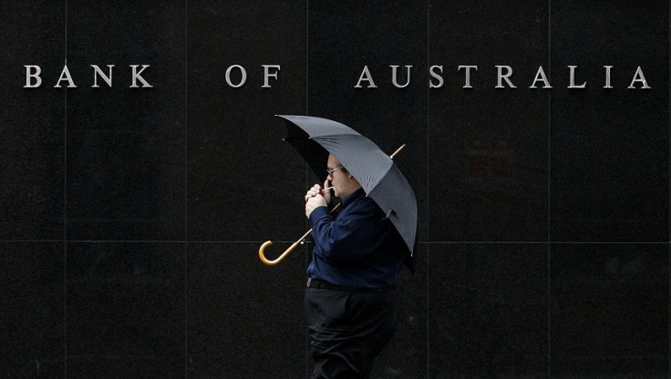 A man smokes while he walks past the Reserve Bank of Australia building in central Sydney April 21, 2009.
