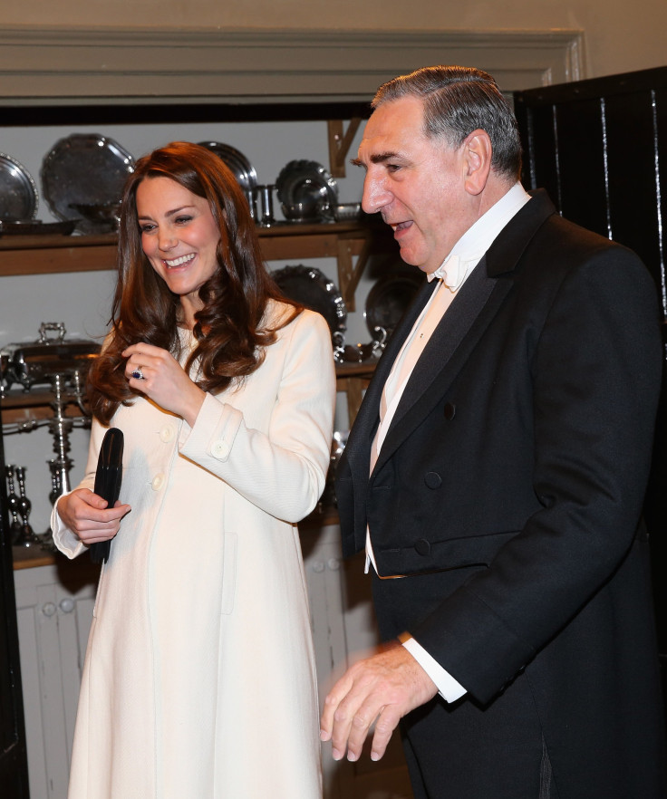 Britain's Catherine, Duchess of Cambridge chats to actor Jim Carter (who plays Carson) during a visit to the set of Downton Abbey 