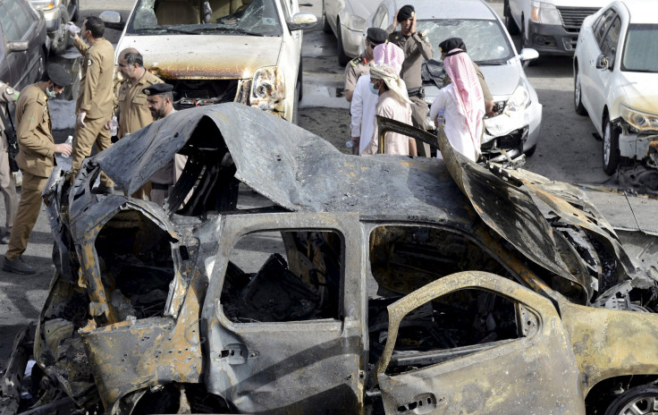 IN PHOTO: Policemen carry out an inspection after a car exploded near the Shi'ite al-Anoud mosque in Saudi Arabia's Dammam May 29, 2015.