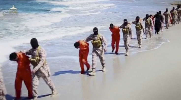 IN PHOTO: Islamic State militants lead what are said to be Ethiopian Christians along a beach in Wilayat Barqa, in this still image from an undated video made available on a social media website on April 19, 2015. 