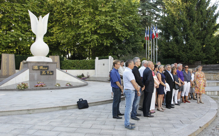 IN PHOTO: People pay tribute to the victim of the attack at a gas company site at the industrial area of Saint-Quentin-Fallavier during a ceremony at the Peace Memorial in Bourgoin-Jallieu, near Lyon, France, June 26, 2015.