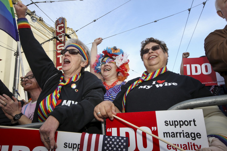 IN PHOTO: Glenda Vieira, (L) Mary Ayers and Tina Vieira celebrate the United States Supreme Court's landmark decision that legalized same-sex marriage throughout the country in San Francisco