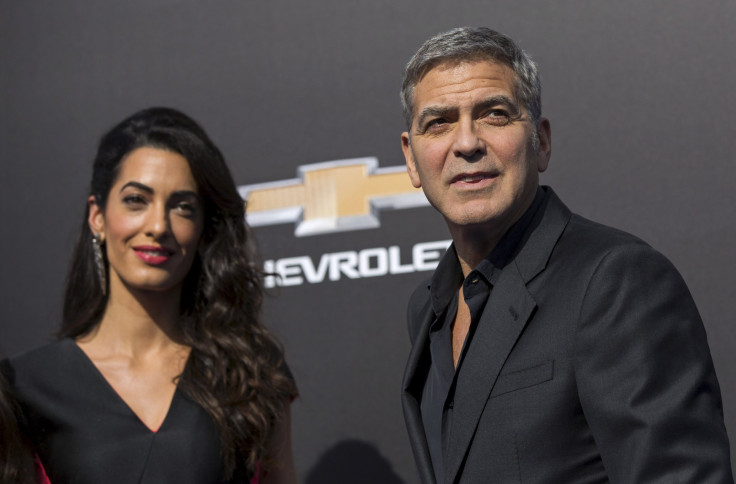 [9:37] Cast member George Clooney and his wife Amal pose at the premiere of "Tomorrowland" at AMC theatres in Downtown Disney in Anaheim, California 