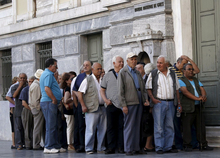 Pensioners line up outside a National Bank in Athens, Greece
