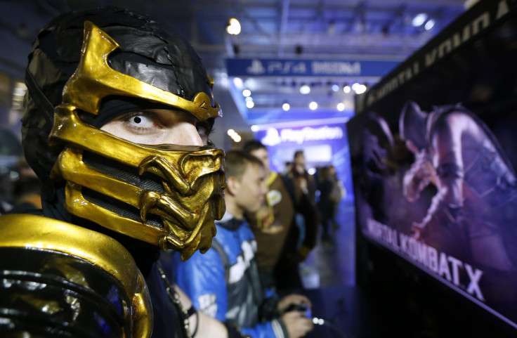 A participant dressed as the character "Scorpion" from the upcoming 2015 "Mortal Kombat X" fighting game is seen at Comic-Con Russia convention and IgroMir 2014 exhibition in Moscow, October 3, 2014.  