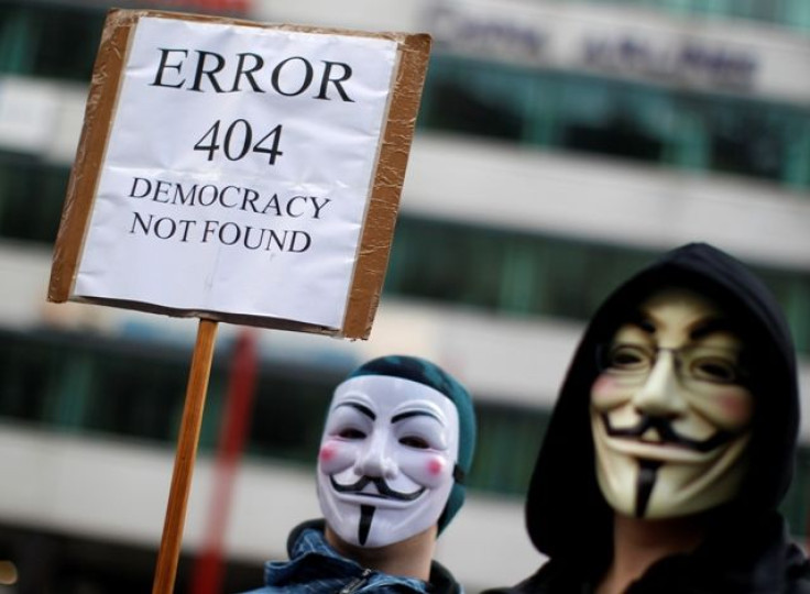 Protesters In Guy Fawkes Masks