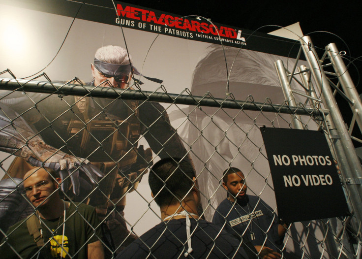 Video game enthusiasts line up behind fences with barbed wire at the Konami booth to play the new game "Metal Gear Solid 4" at the E for All video game expo in Los Angeles, California October 19, 2007. 