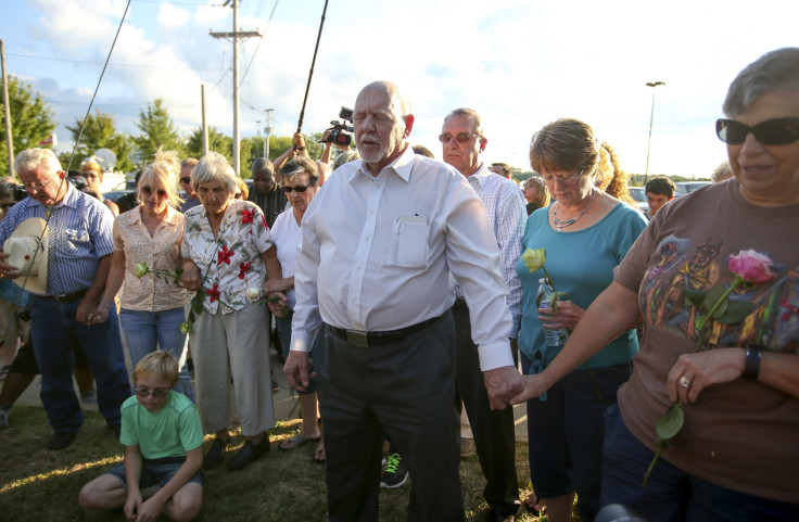 Members of a local church hold a brief prayer service outside of the offices of WDBJ7 in Roanoke, Virginia August 26, 2015. 