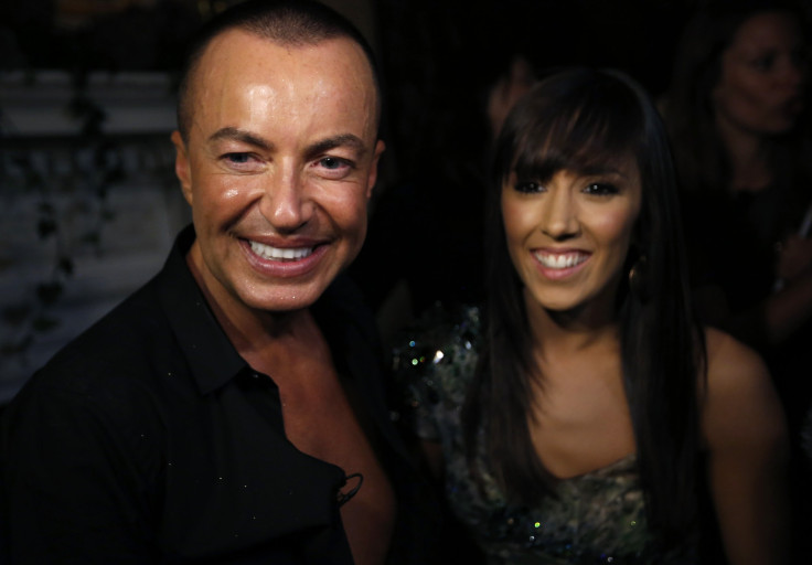 Designer Julien Macdonald is seen with his "Strictly Come Dancing" dance partner Janette Manrara during an interview with Reuters after the Julien Macdonald Spring/Summer 2014 show during London Fashion Week September 14, 2013.