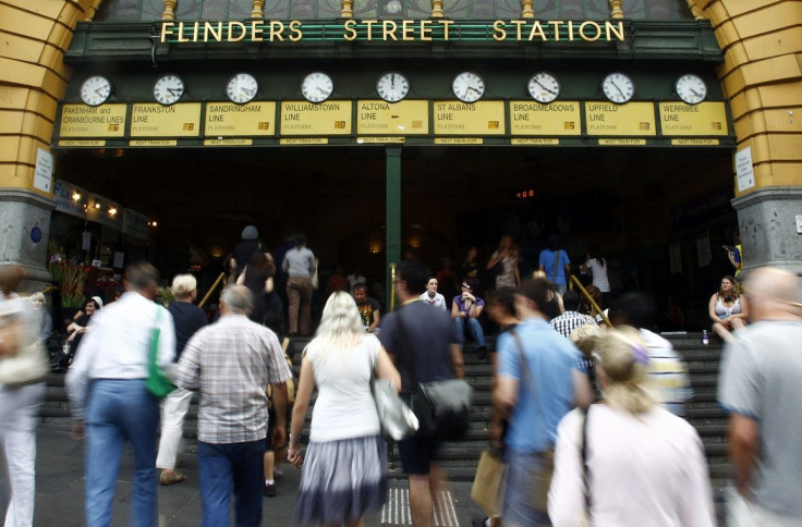 Office workers head to Flinders Street Station in central Melbourne February 10, 2011.