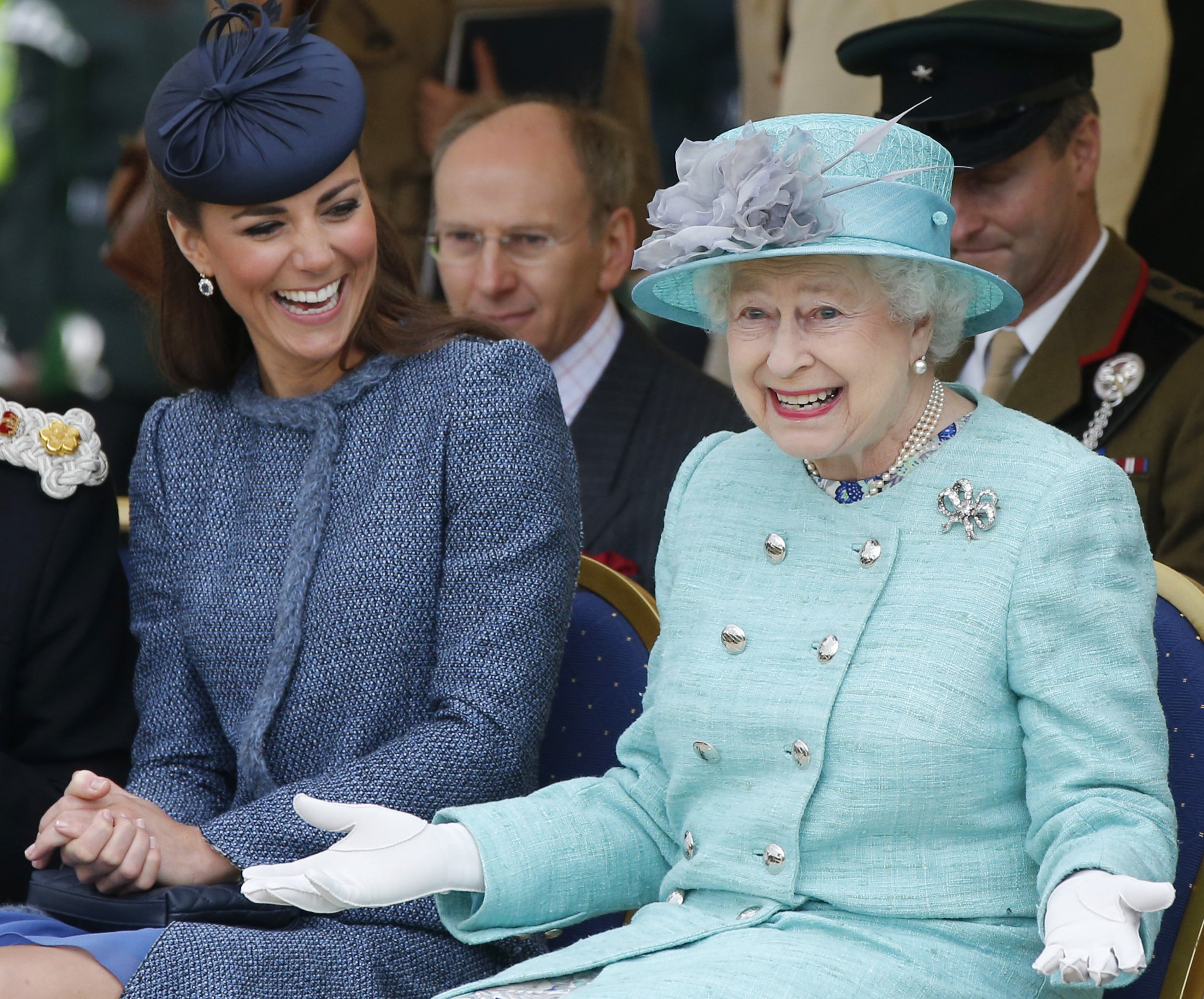 1105 Britains Catherine, Duchess of Cambridge L laughs as Queen Elizabeth gestures while they watch part of a childrens sports event during a visit to Vernon Park in Nottingham