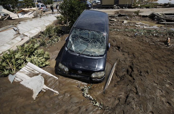 A damaged vehicle is seen at a residential area flooded by the Kinugawa river, caused by typhoon Etau, in Joso, Ibaraki prefecture, Japan, September 11, 2015.