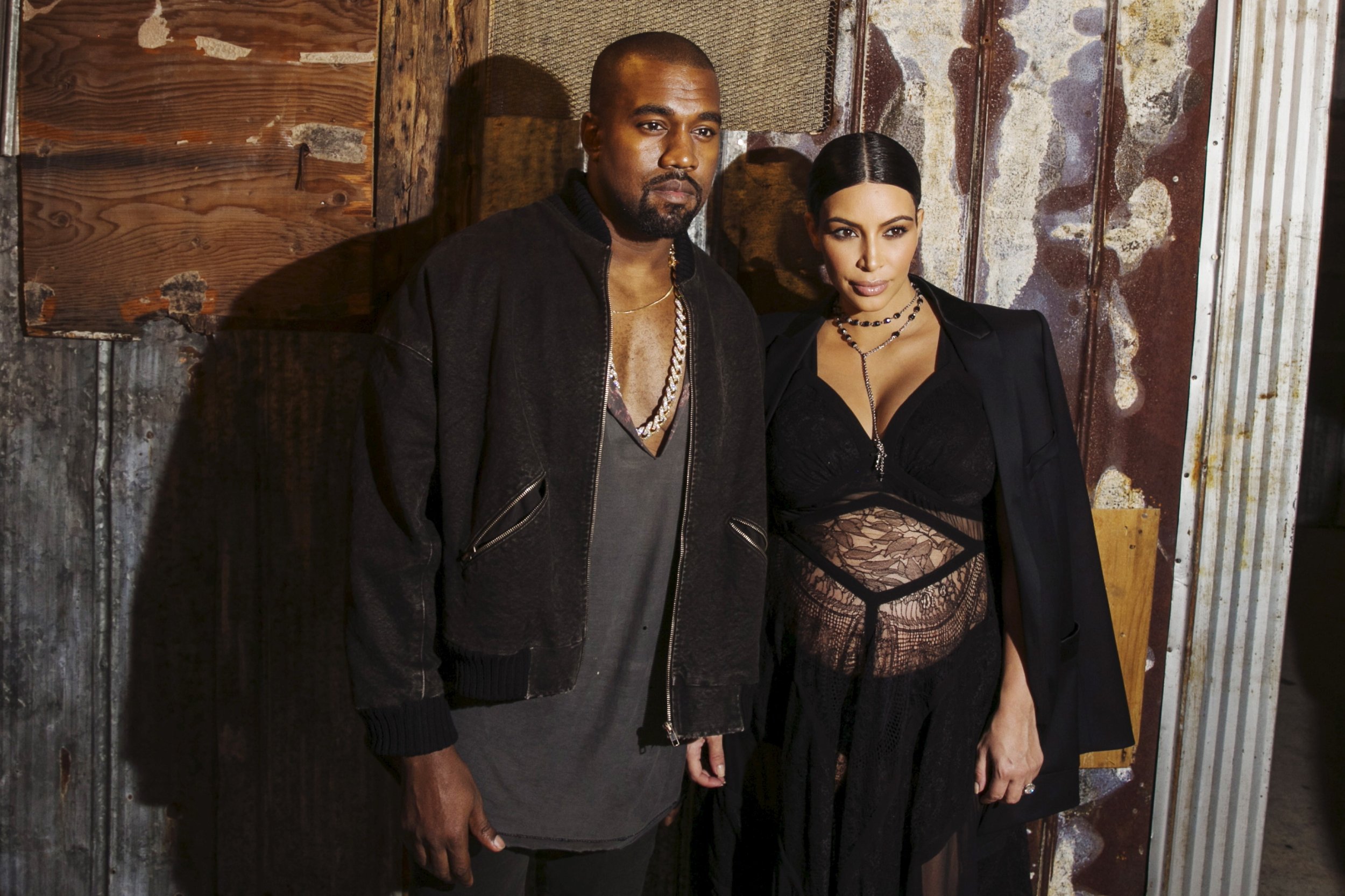 1227 Musician Kanye West stands with his wife Kim Kardashian after watching the Givenchy SpringSummer 2016 collection 