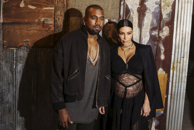 [12:27] Musician Kanye West stands with his wife Kim Kardashian after watching the Givenchy Spring/Summer 2016 collection 