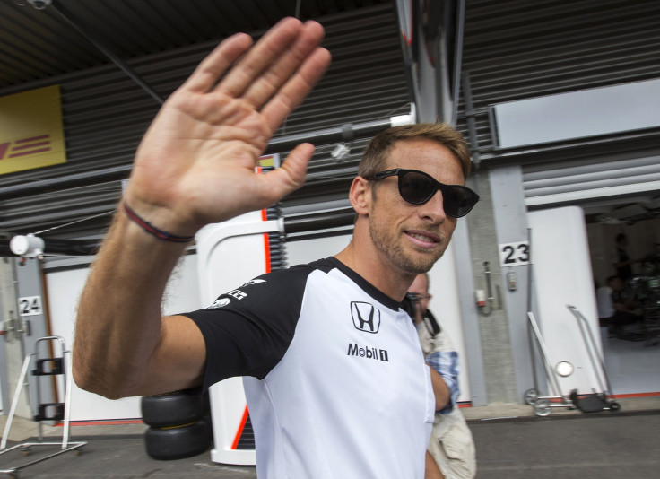 Jenson Button waves to supporters