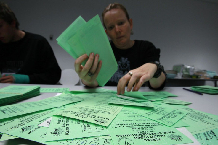 An electoral official counts ballot papers at an Australian Electoral Commission office in Melbourne August 24, 2010.