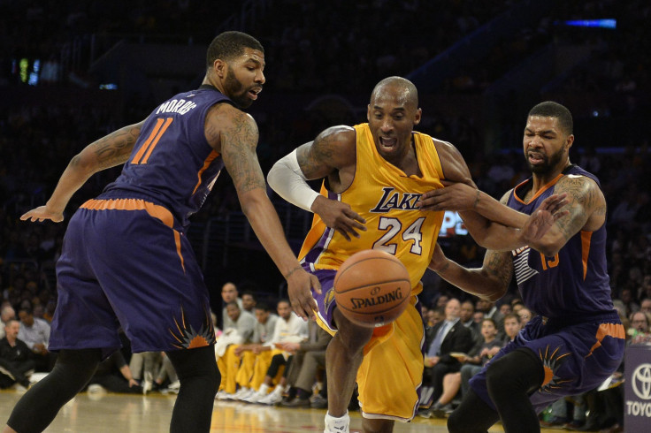 Morris twins guarding Bryant in 2014