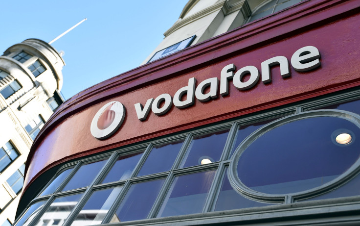 Branding for Vodafone is seen on the exterior of a shop in London, Britain, September 10, 2015.