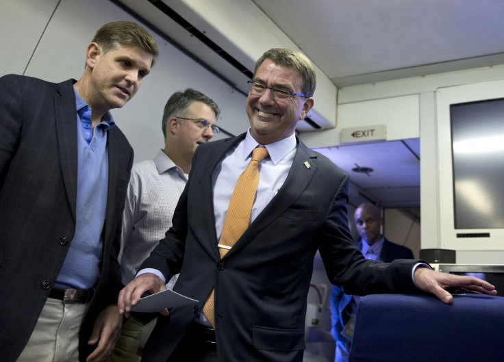 U.S. Defense Secretary Ash Carter, joined by U.S. Department of Defense press secretary Peter Cook (L)