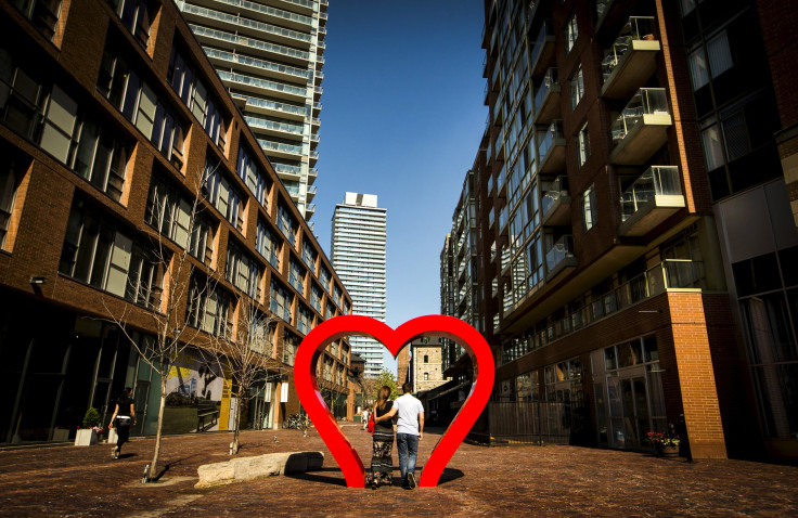 Couple walks through heart installation