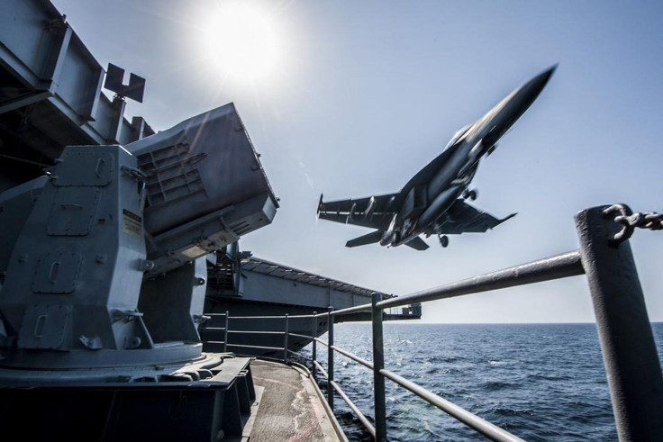 A U.S. Navy F/A-18 launches from the USS Carl Vinson in this undated handout picture released November 1, 2014.