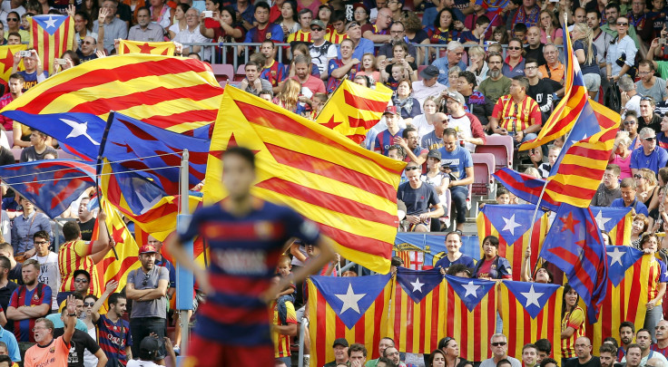 Barcelona fans wave the Catalan flag during a match.