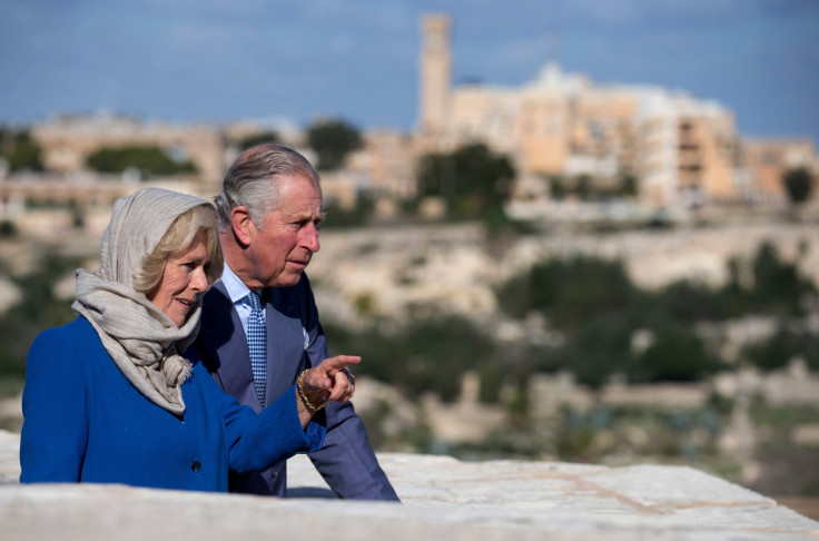 Britain's Prince Charles and Camilla, the Duchess of Cornwall, look on during a tour through the old town of Mdina during the Commonwealth Heads of Government Meeting
