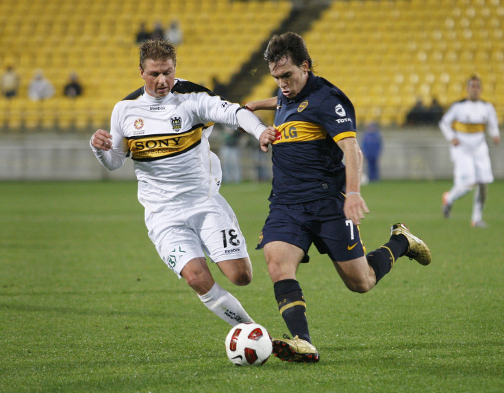 Wellington Phoenix's Sigmund challenges Boca Juniors' Mouche during their friendly soccer match in Wellington