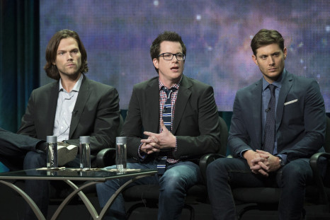 Writer Jeremy Carver (C) speaks next to cast members Jared Padalecki (L) and Jensen Ackles at a panel for The CW  television series "Supernatural"