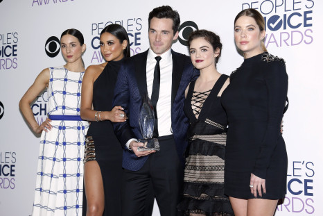 The cast of "Pretty Little Liars" poses backstage with their award for Favorite Cable TV Drama 