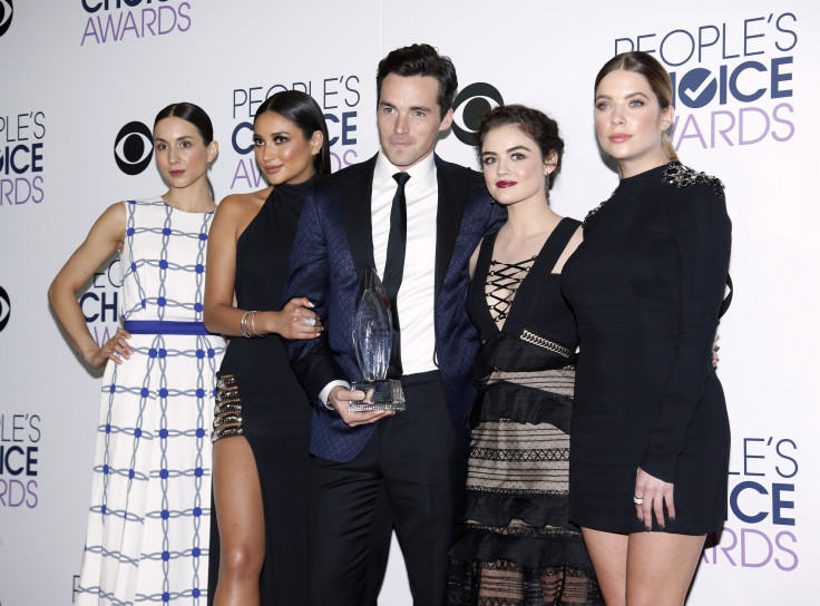 The cast of "Pretty Little Liars" poses backstage with their award for Favorite Cable TV Drama 