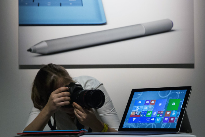 An attendee photographs the new Microsoft Surface Pro 3, during the event in New York May 20, 2014. 