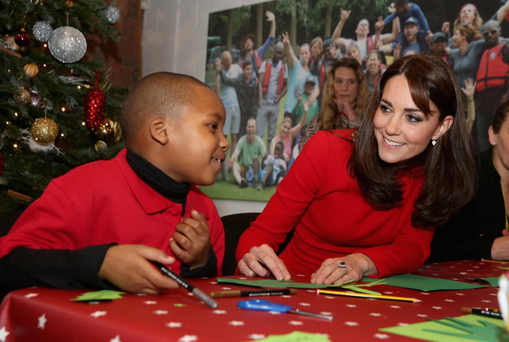Britain's Catherine, Duchess of Cambridge takes part in group activities as she attends the Anna Freud Centre Family School Christmas Party