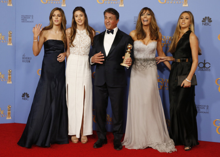 Sylvester Stallone and his wife Jennifer Flavin (2nd R) and their daughters, Sistine (L), Scarlet, (2nd L) and Sophia, pose with his award for Best Performance by an Actor in a Supporting Role in any Motion Picture