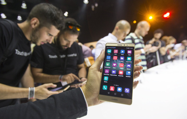 Journalists inspect the new smartphone Huawei Mate S ahead the of the IFA Electronics show in Berlin, Germany, September 2, 2015.
