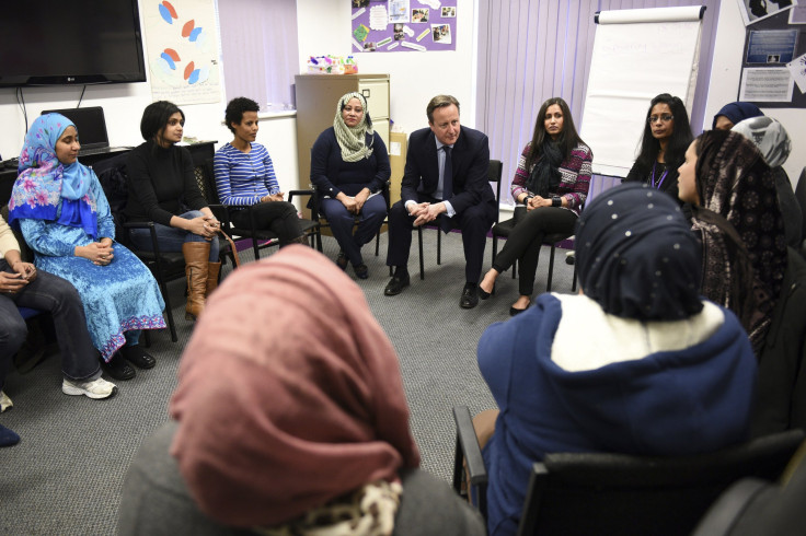 Britain's Prime Minister David Cameron speaks with women attending an English language class during a visit to the Shantona Women's Centre in Leeds, Britain January 18, 2016.