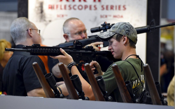 Attendees visit the trade booths during the National Rifle Association's annual meeting in Nashville, Tennessee April 12, 2015.