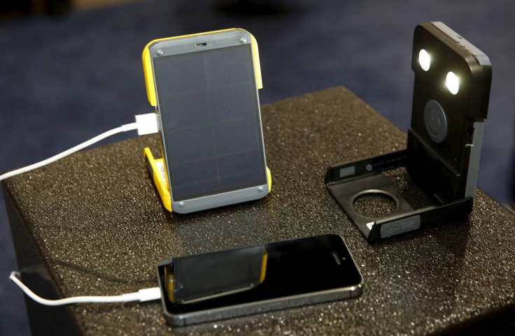 The WakaWaka Power+ compact solar charger and WakaWaka Light flashlight are displayed during the 2016 CES trade show in Las Vegas, Nevada January 8, 2016.