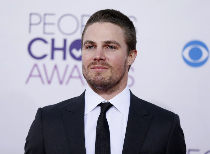 Stephen Amell, of the television series "Arrow," arrives at the 2013 People's Choice Awards in Los Angeles, January 9, 2013.