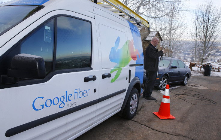 A technician gets cabling out of his truck to install Google Fiber in a residential home in Provo, Utah, January 2, 2014. 