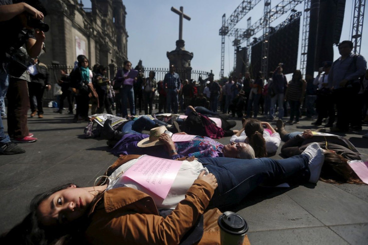 Activists protest violence against women outside Metropolitan Cathedral in Mexico City, February 11, 2016.