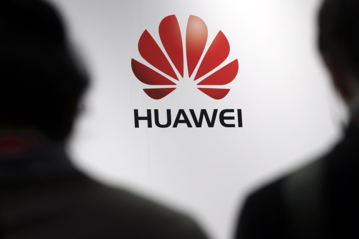 Journalists attend the presentation of the Huawei's new smartphone, the Ascend P7, launched by China's Huawei Technologies in Paris, May 7, 2014. 