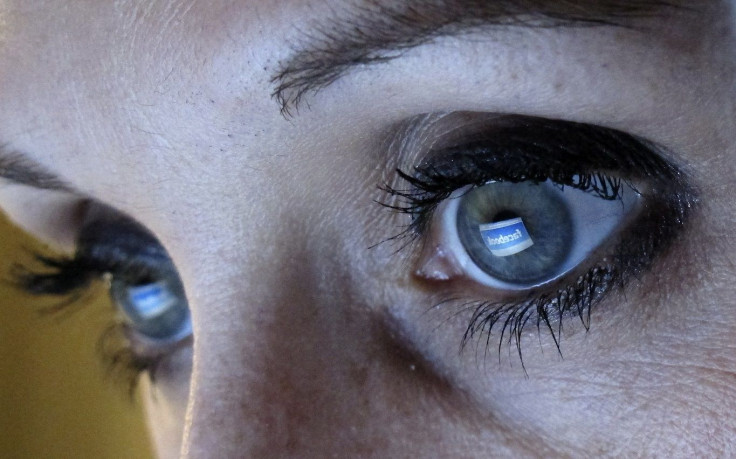 An illustration picture shows a woman looking at the Facebook website on a computer in Munich February 2, 2012.