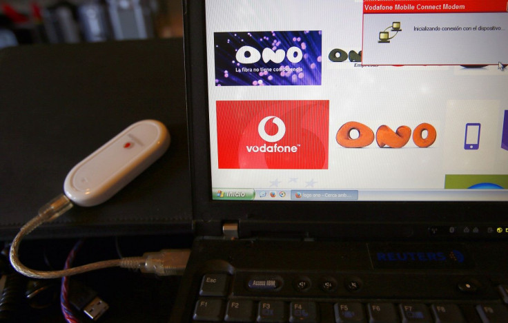 A Vodafone device connected to a laptop and an internet page with logo from Ono and Vodafone, is seen at an office in Barcelona, March 17, 2014.
