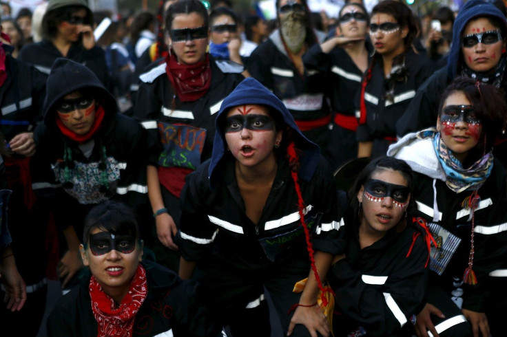 Women shout slogans during a demonstration to mark International Women's Day in Santiago, March 8, 2016.