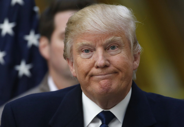 Republican U.S. presidential candidate Donald Trump reacts during a news conference at the construction site of the Trump International Hotel at the Old Post Office Building in Washington.