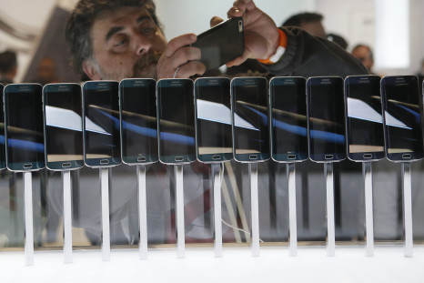 A row of Galaxy S6 edge smartphones are seen on display at the Samsung Galaxy Unpacked event before the Mobile World Congress in Barcelona March 1, 2015. 