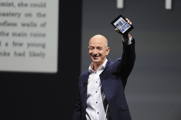 Amazon CEO Jeff Bezos holds up a Kindle Paperwhite during Amazon's Kindle Fire event in Santa Monica, California September 6, 2012. 